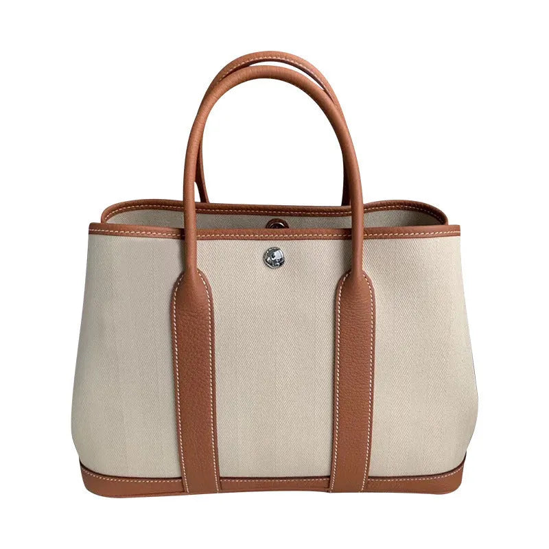 Women's genuine leather and canvas crossbody tote bucket bag with interior organisation