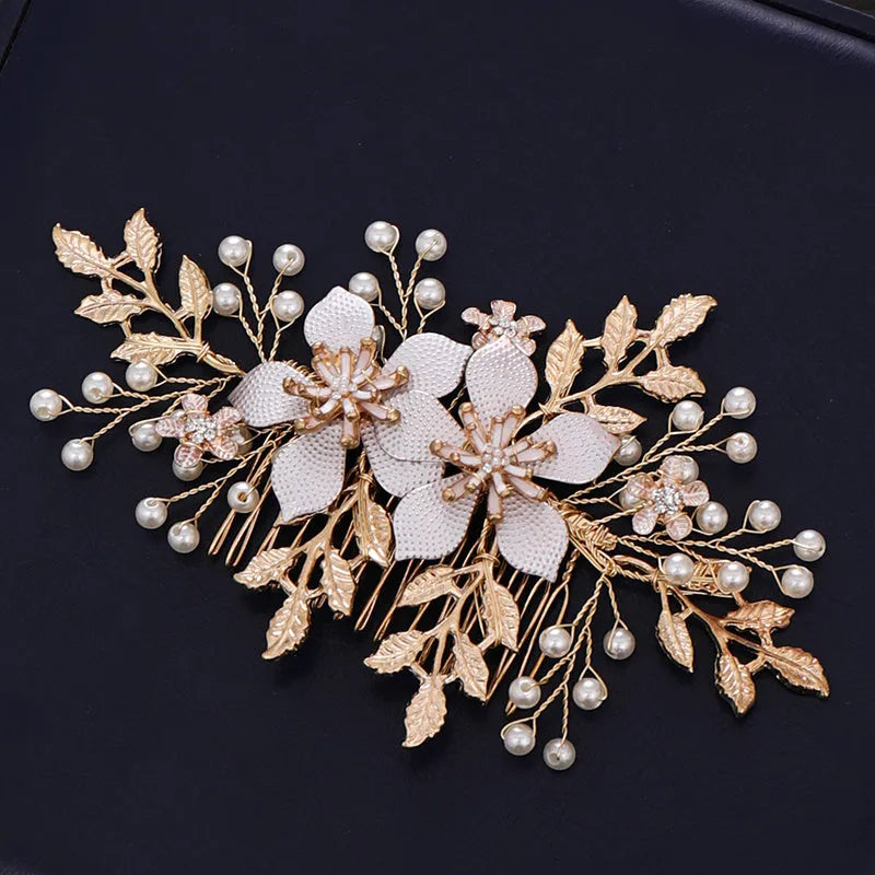 Gold bridal hair comb with pearl and white crystal flower design on head
