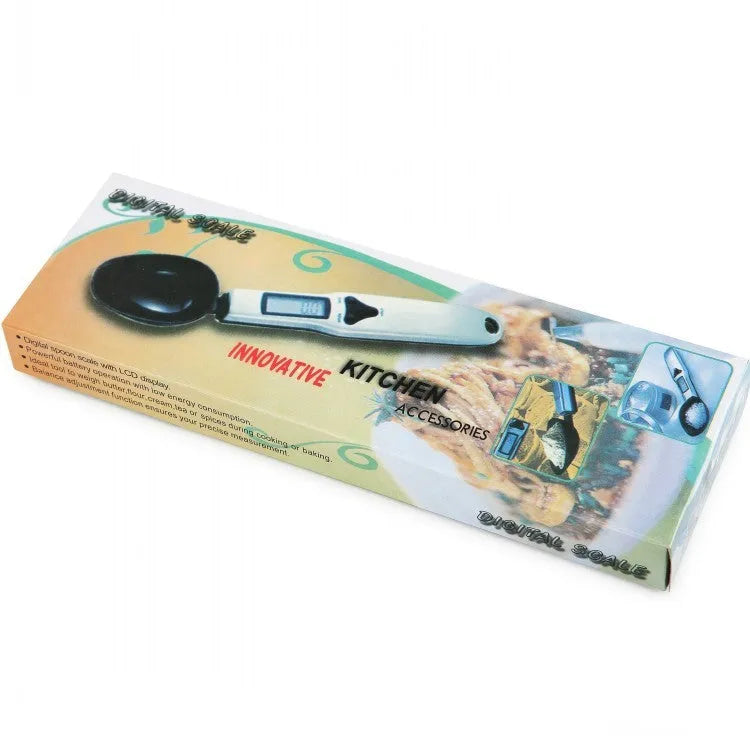Smart digital kitchen measuring spoon with LCD display showing weight measurement.