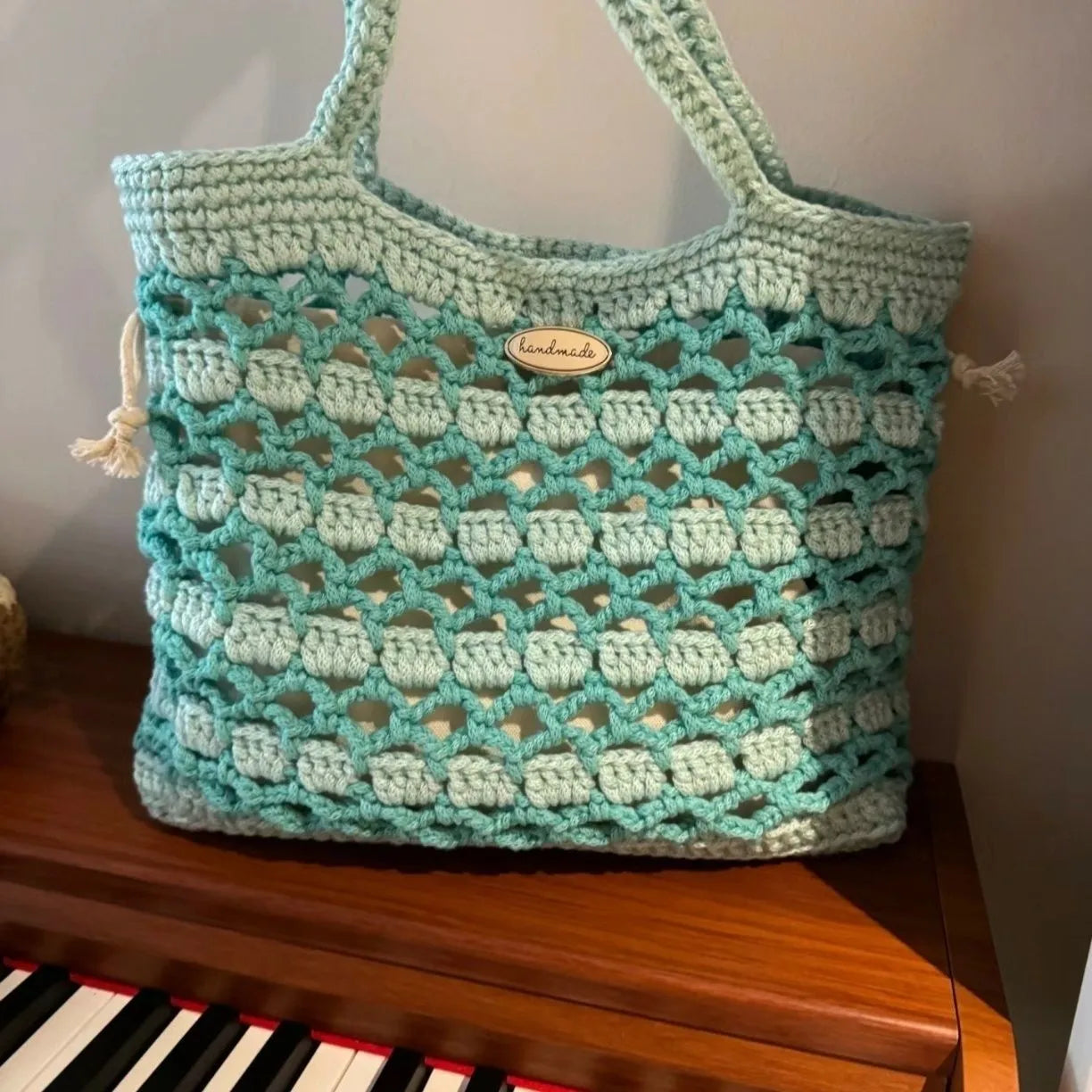 Handwoven wool bag with a summer floral pattern in style variation 1
