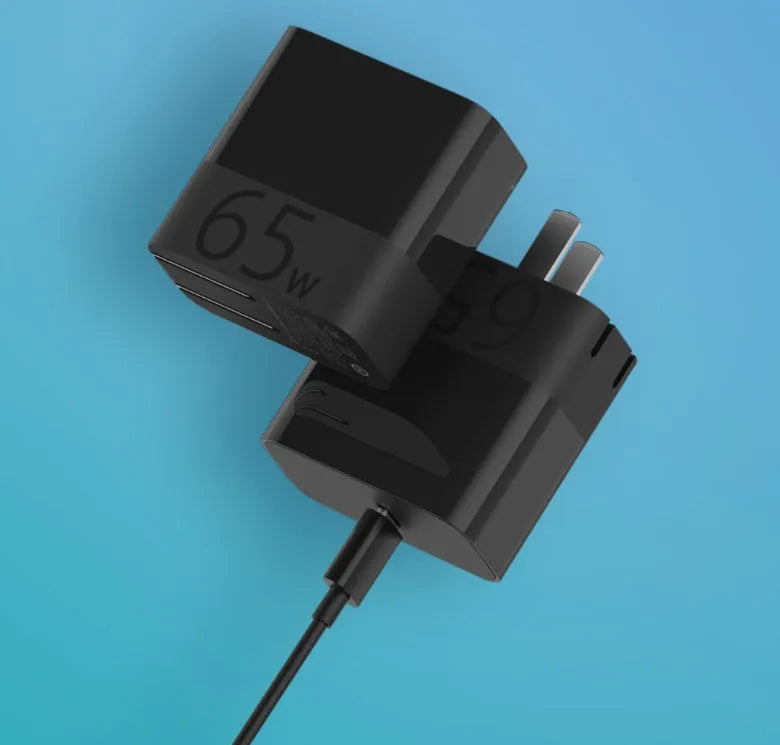 Black ZMI USB-C 65W compact notebook power adapter with folded plug.