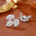Leaf shaped zircon earrings in white gold colour with copper base and quadrilateral inlay