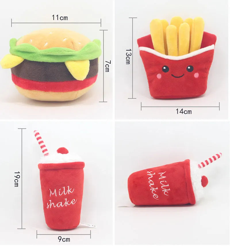 Plush pet toys shaped like a hamburger, french fries, and a milkshake cup on a plain background.