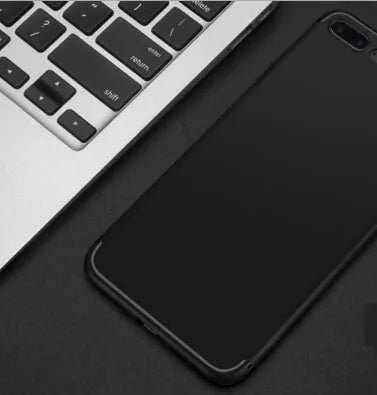 Flexible black TPU silicone protective case on an Apple iPhone.
