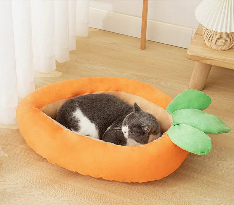 Carrot-shaped nesting dog bed with a soft blanket for small to medium-sized dogs.