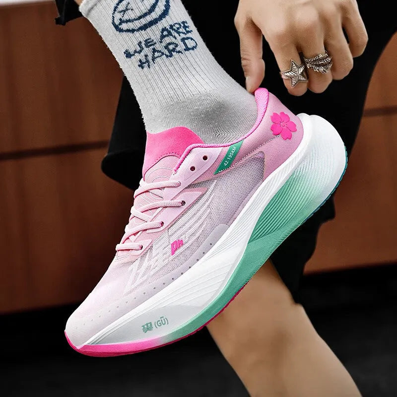 Low top carbon plate racing sneaker in Glacier colour with PU mesh upper and natural rubber sole.