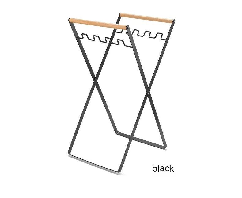 Folding outdoor rubbish rack with iron frame and wooden handle, shown in black colour.