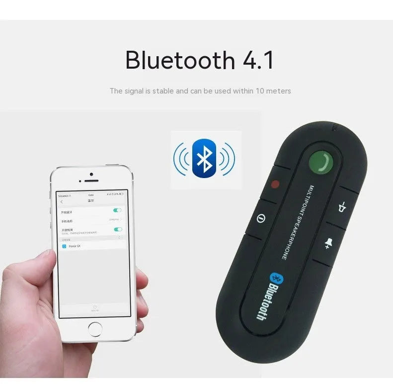 Black vehicle-mounted Bluetooth handsfree device clipped to car sun visor with aux cable
