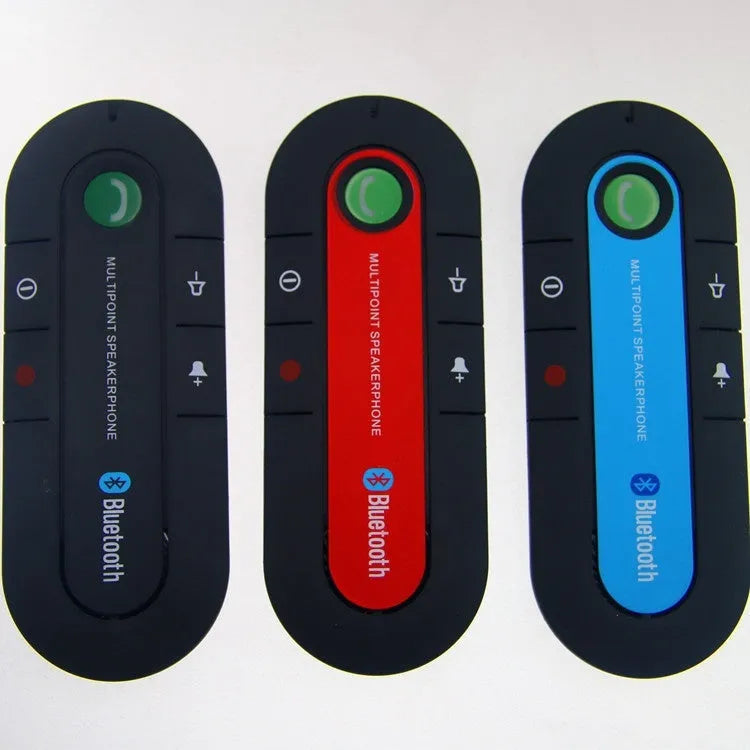 Black vehicle-mounted Bluetooth handsfree device clipped to car sun visor with aux cable