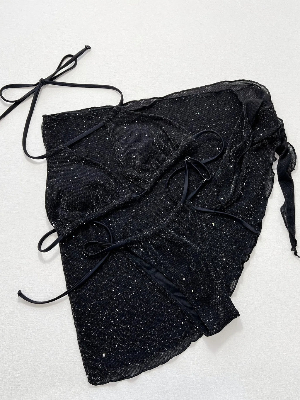 Black three-piece swimsuit bikini set with matching shorts on a mannequin