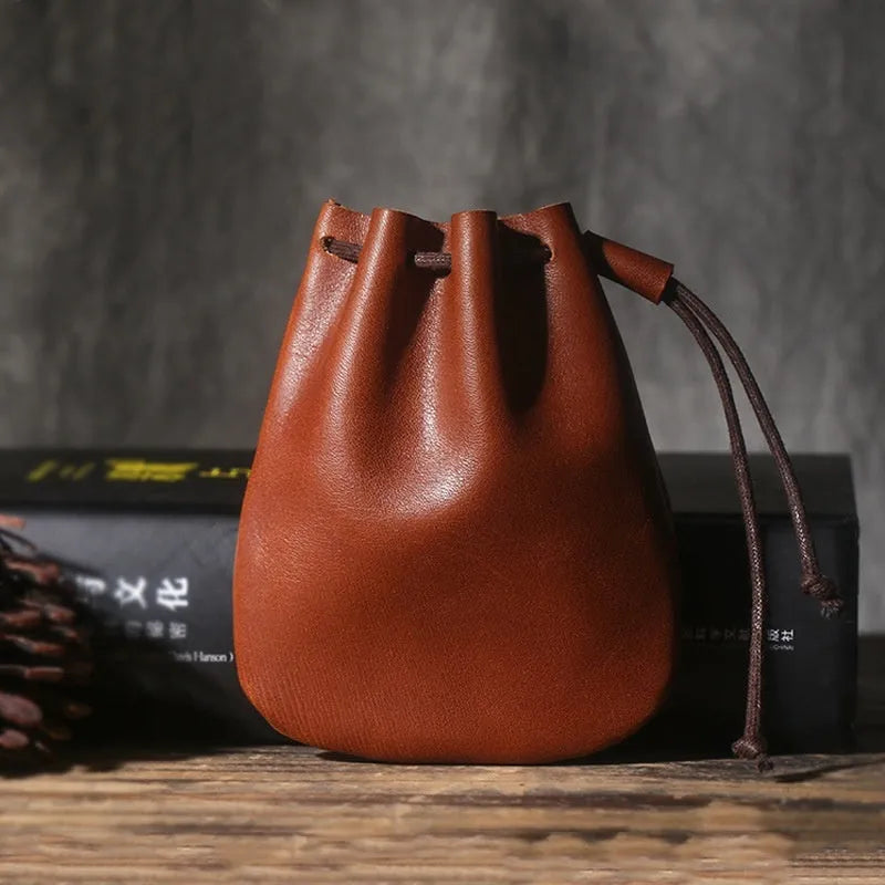 Vintage cowhide drawstring bundle wallet in genuine leather showing drawstring closure and sewing thread details