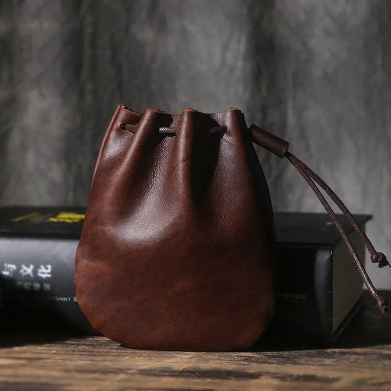 Vintage cowhide drawstring bundle wallet in genuine leather showing drawstring closure and sewing thread details