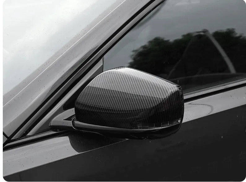 Pair of ABS plastic rearview mirror covers for Cadillac CT5 CT6 in carbon fibre, silver, and rain frame finish options.