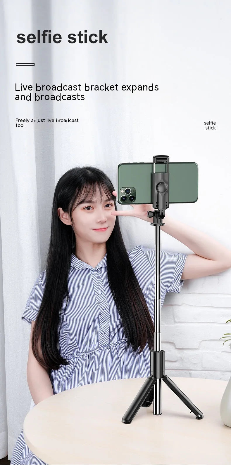 Black selfie stick tripod with wireless Bluetooth remote and universal phone holder, anti-shake floor stand.