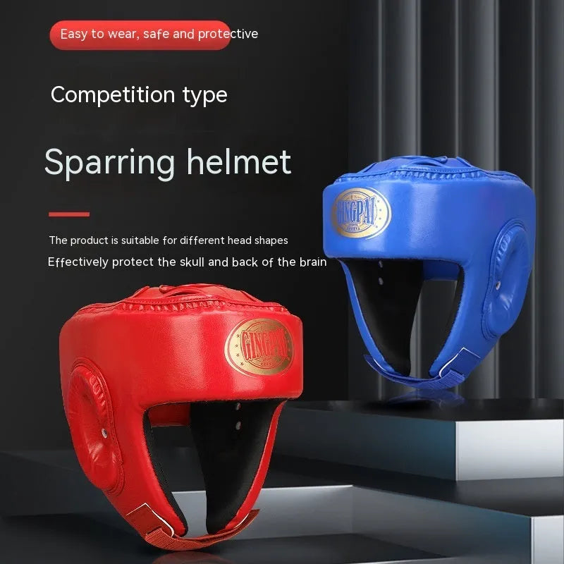 Red fully enclosed boxing helmet with jaw protection on a white background.
