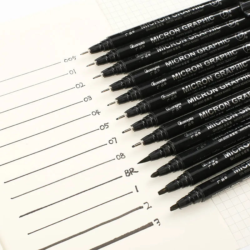 Set of 12 black comic art pens with 9 microtip nib sizes in storage organiser for detailed drawing