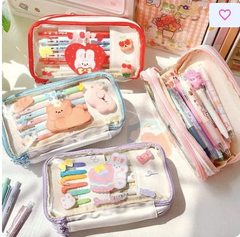 Transparent heart-shaped pencil case with Korean style design in pink rabbit theme showing pens inside