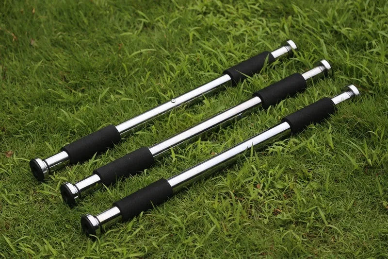 Steel adjustable width pull-up bar mounted in a door frame for home fitness