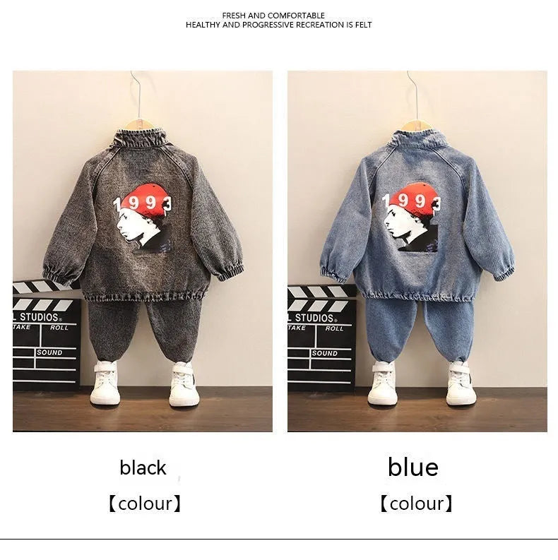 Boys' black denim two-piece suit with long sleeves, shown on a hanger.