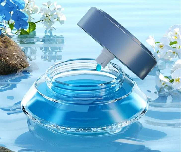Magnetic car air freshener unit in Gentleman's Black or Qian Shan Cui colour, shown with fragrance fluid.