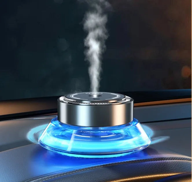 Magnetic car air freshener unit in Gentleman's Black or Qian Shan Cui colour, shown with fragrance fluid.