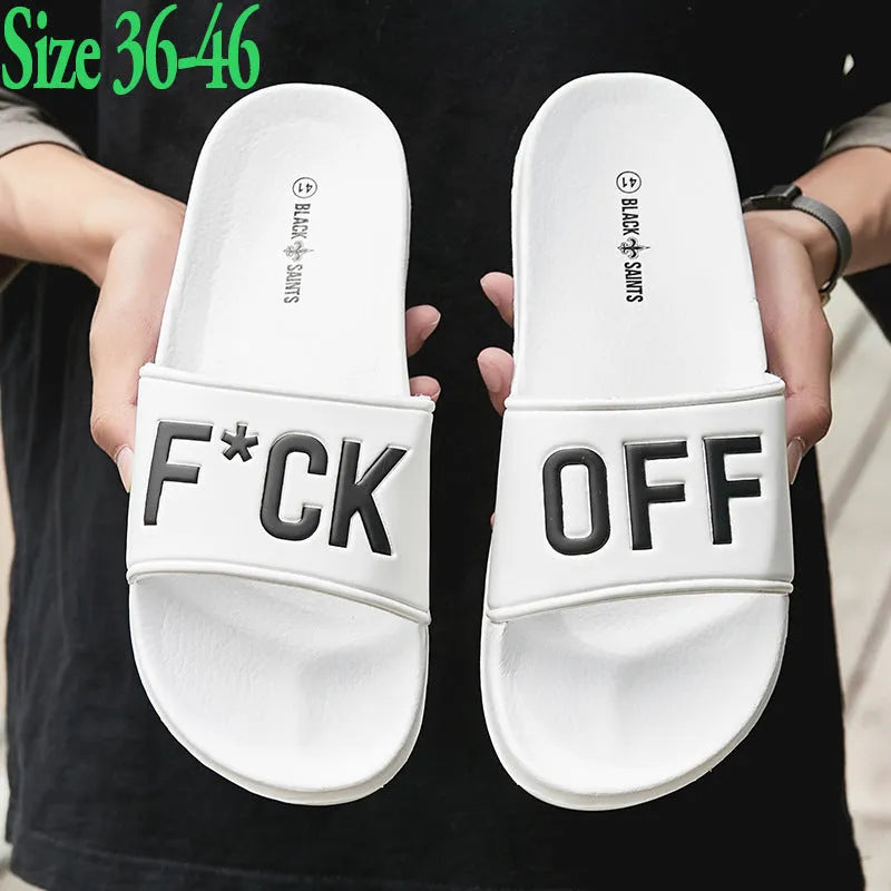 Large black and white open-toe men's slippers with a rubber sole, showing size range 36 to 46.