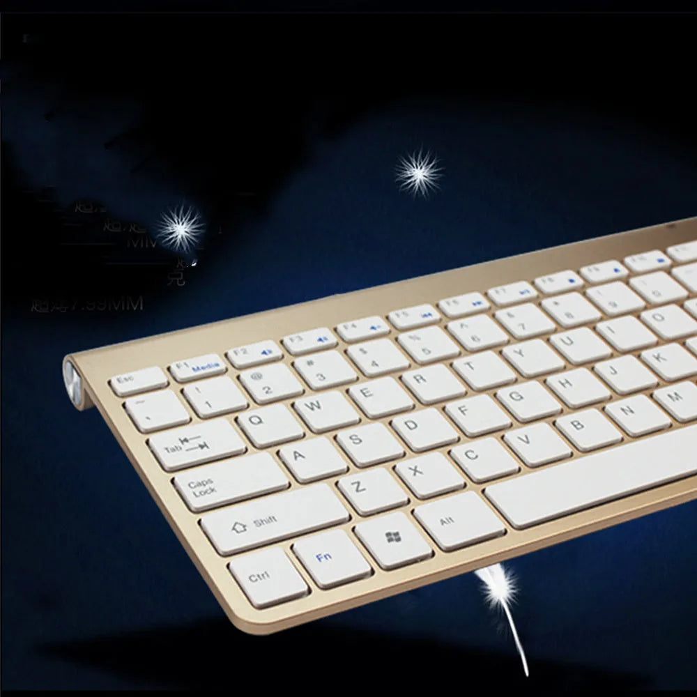 2.4G wireless keyboard and mouse combo set in silver colour on a desk with laptop