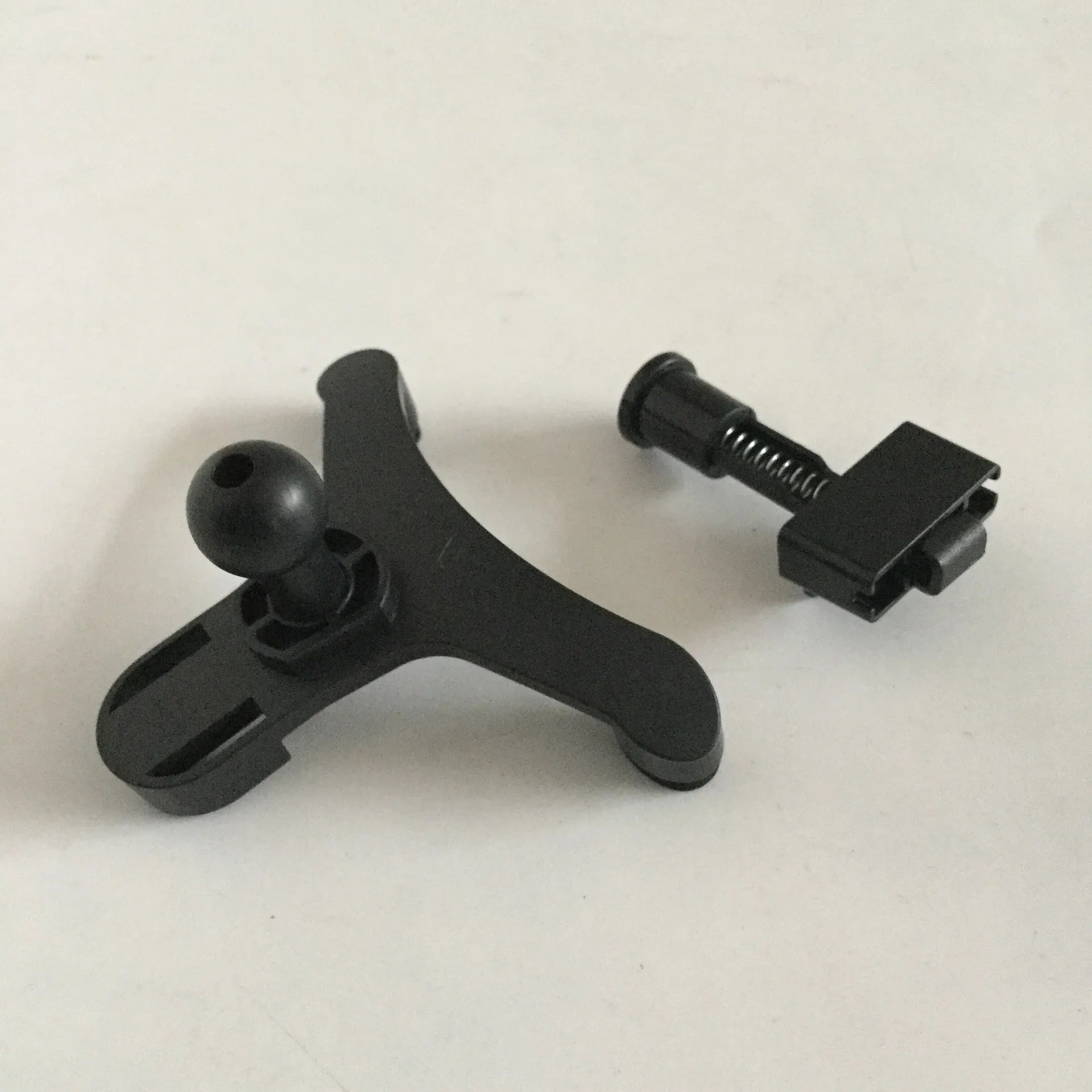 King Kong style car centre console phone stand holding a mobile phone on dashboard