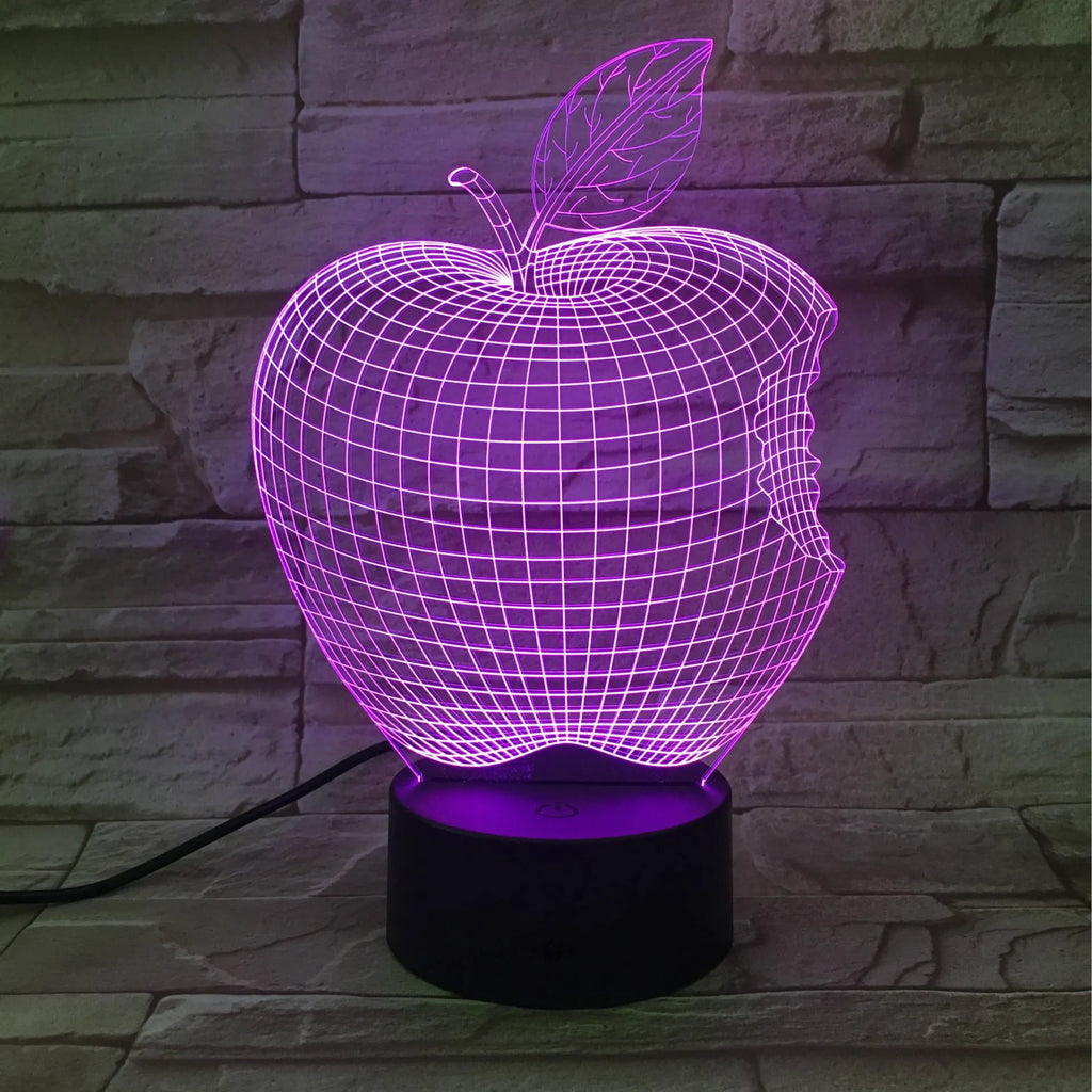 Colourful 3D fruit-shaped acrylic LED night light with touch controls on a dark surface.