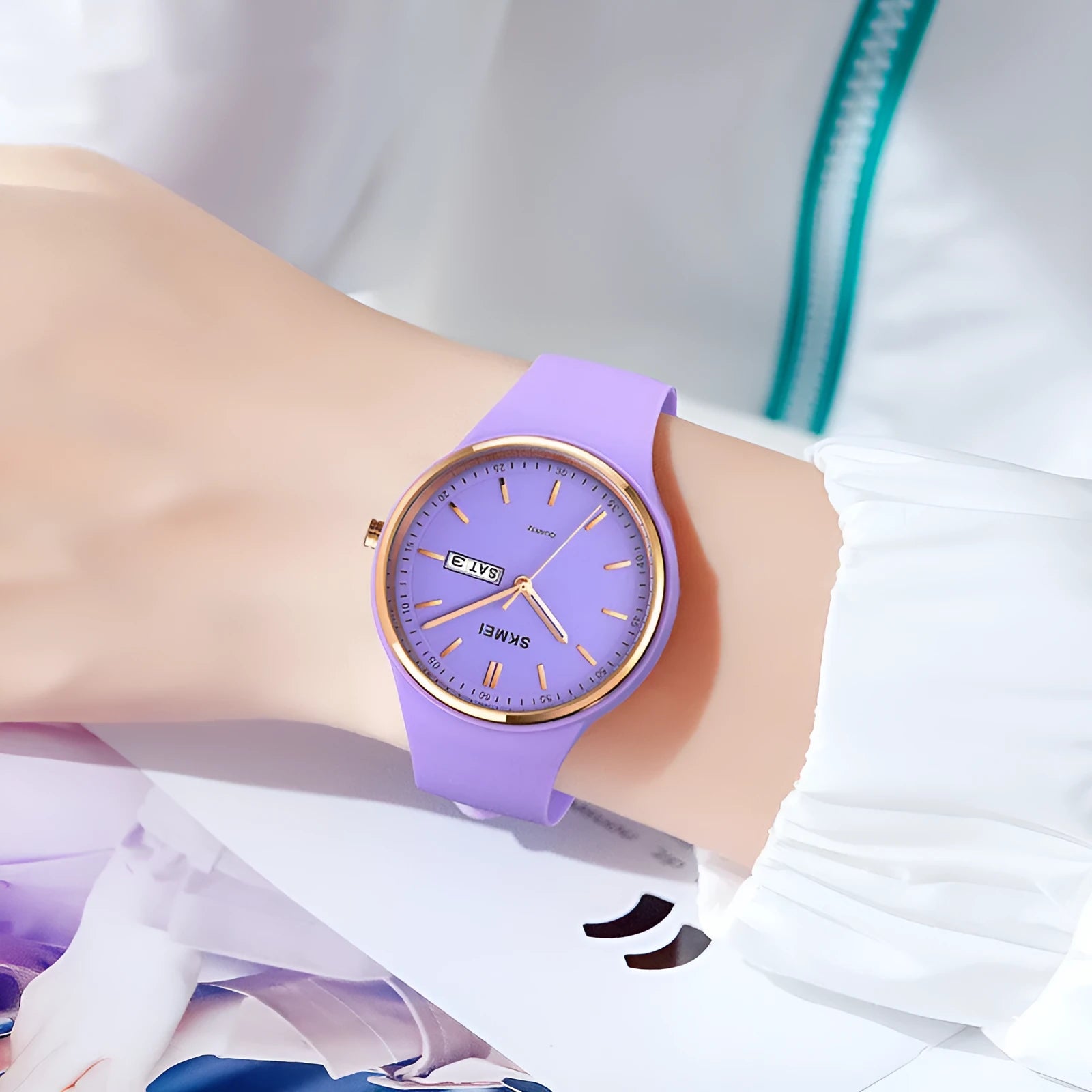 Women's silicone strap quartz watch with white dial on a light blue strap, showing calendar window.
