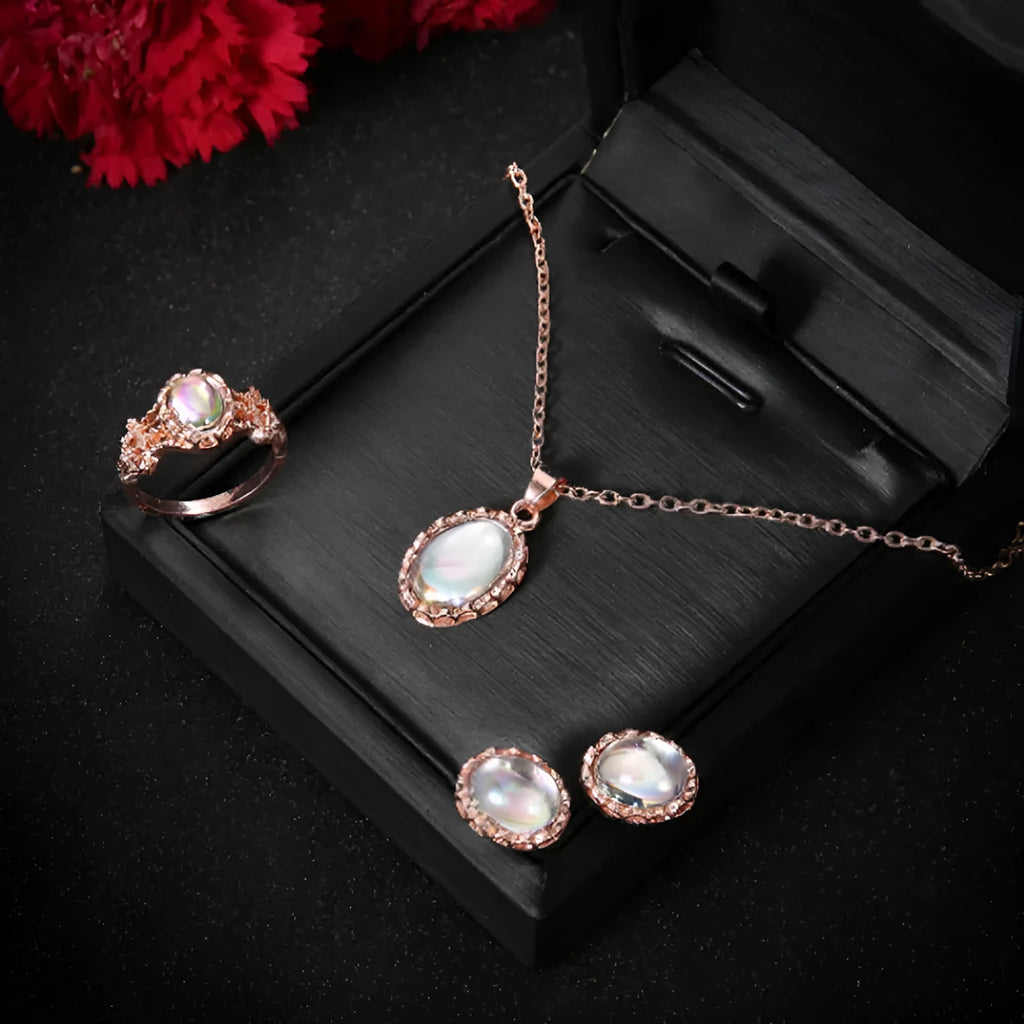 Women's pendant necklace set in alloy with electroplating and inlaid artificial gems, supplied with earrings and hand accessories.