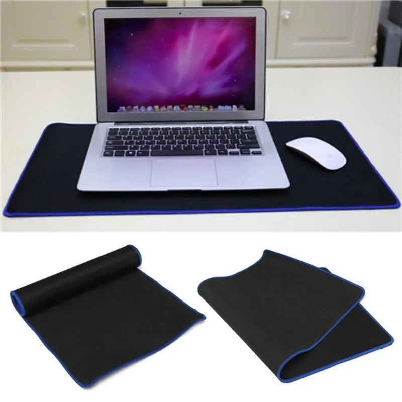 Oversized rubber mouse pad 30x60cm in black with stitched edges for PC laptop use.