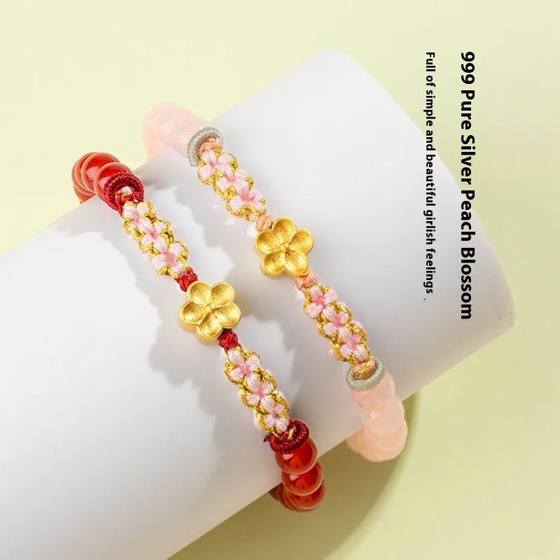 Hand-woven red rope bracelet with diamond-shaped crystal peach blossom charm in Chinese style