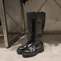 Women's black knee high chunky heel boots with round toe and back zipper.