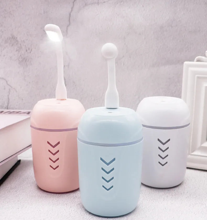 Portable column-shaped car humidifier with aromatherapy function in blue, white, or pink colours