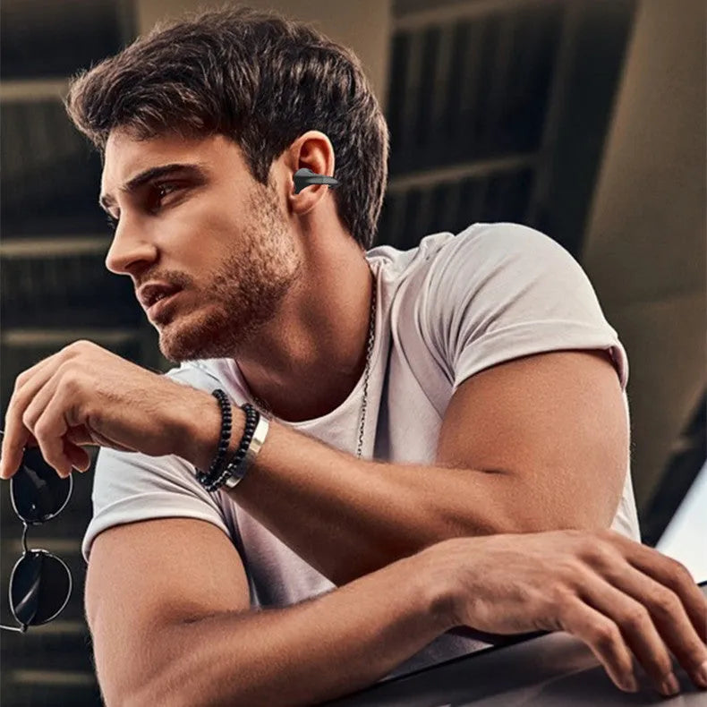 White and black wireless bone conduction Bluetooth headset two-pack with earplug style and headphone compartment.
