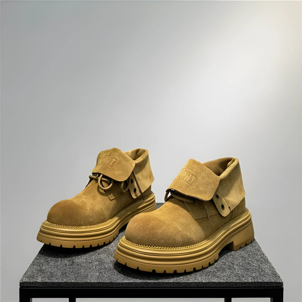 Retro distressed worker style boots in cow suede with thick soles and visible sewing lines