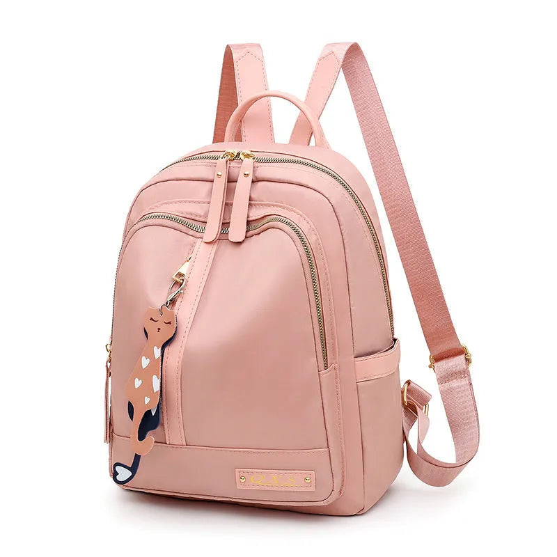 Men's black nylon casual backpack with double straps, a soft handle, and external pocket.
