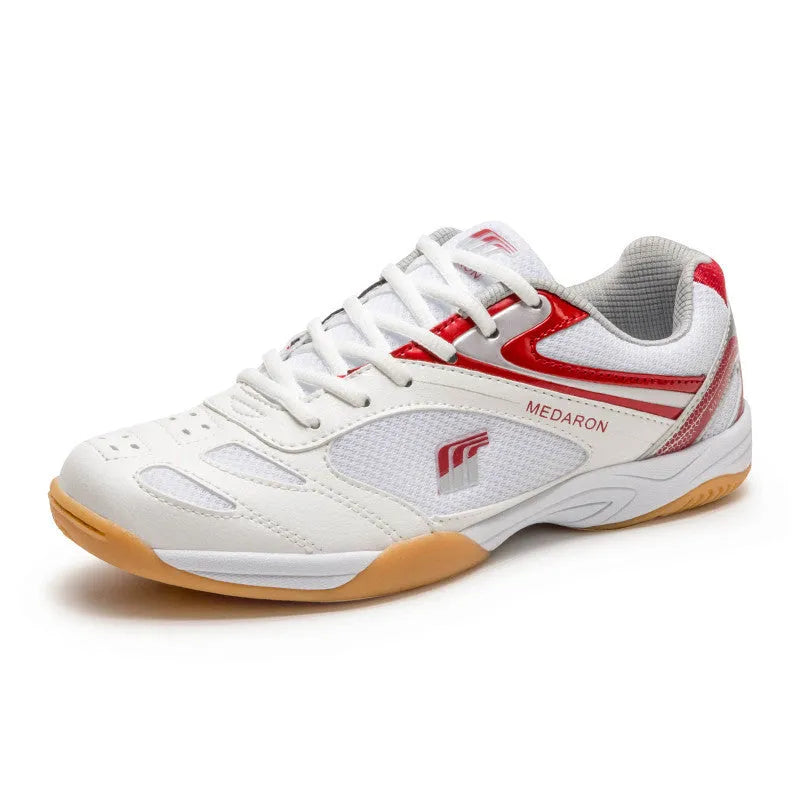 White and blue table tennis sneakers with synthetic leather upper and rubber sole on a court surface.