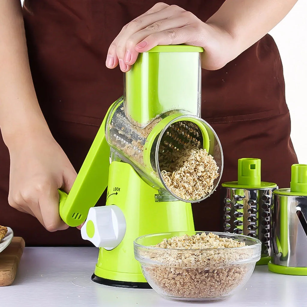 Round mandoline slicer with three stainless steel blades and a suction base in blue green, green, or red