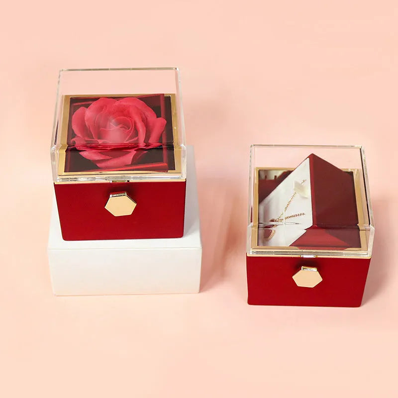 Rotating rose jewellery gift box with acrylic transparent cover showing preserved rose and rotating drawer open.