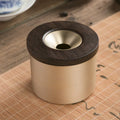 Retro brass ashtray with wooden lid showing centre hole design