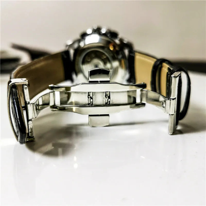 Men's automatic mechanical watch with multifunction display on wrist, showing natural silver case option.
