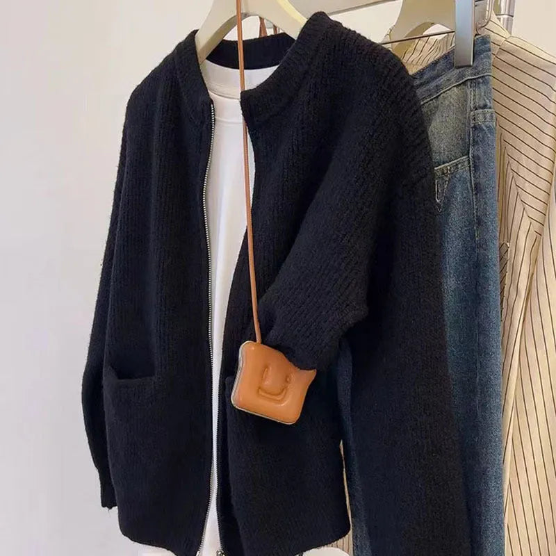 Beige viscose fibre long-sleeve sweater coat cardigan laid flat, showing soft drape and button front.