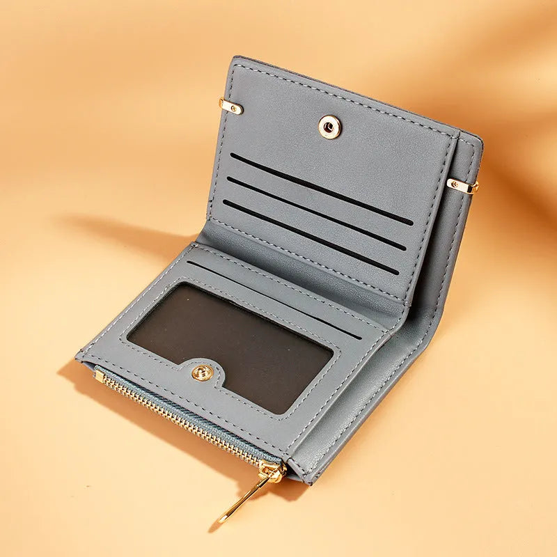 Compact black ladies wallet with zipper closure showing multiple internal card slots and compartments