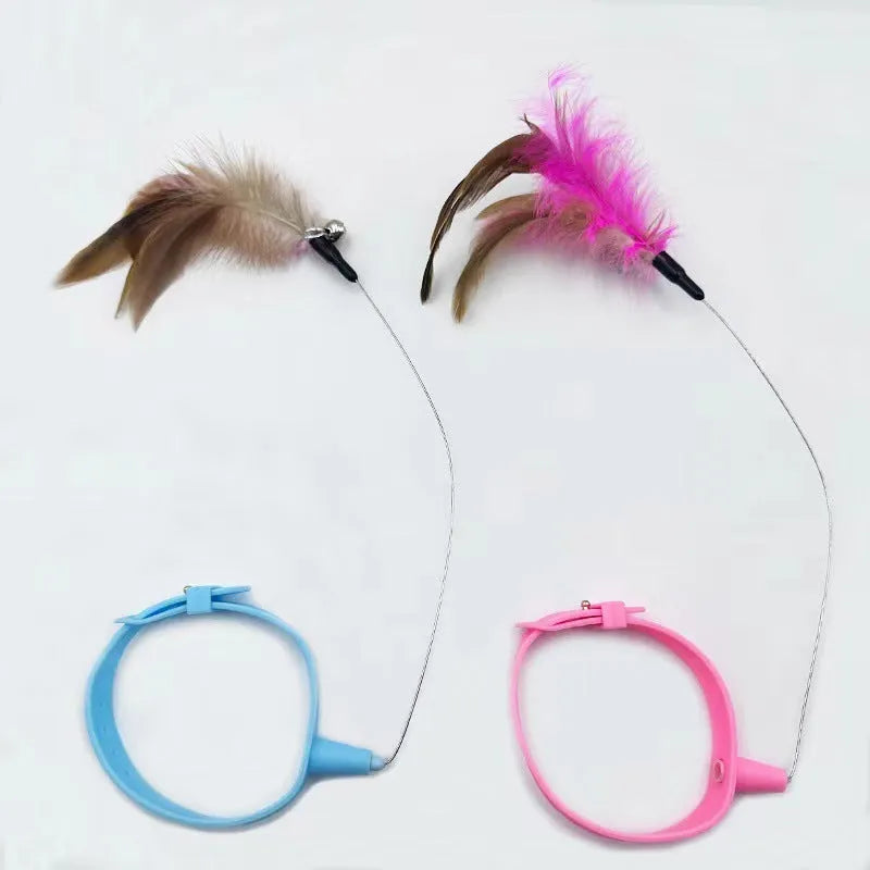 Blue adjustable cat collar with attached silicone wand, dangling feather, and a small bell for interactive play.