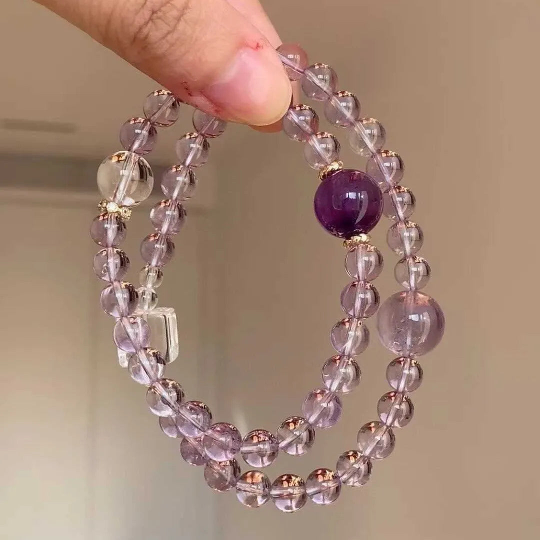 Women's artificial amethyst four-leaf clover bracelet with pearl accents on U-shaped electroplated chain.