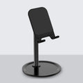 Aluminium mobile phone stand in black or white with silicone grips for phones and tablets