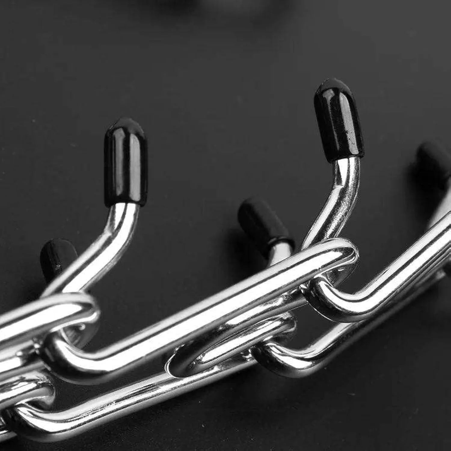 Stainless steel dog prong training collar with rubber tips showing adjustable chain links
