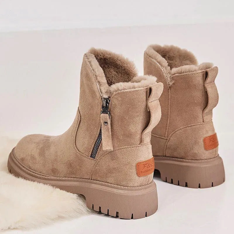 Women's black high-top snow boots with a side zipper and round toe on a non-slip rubber sole.